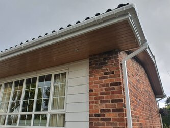 Fascia replacement project removing old damaged boards and installing new uPVC fascias