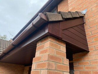 Complete fascia replacement showing before and after with new white uPVC boards