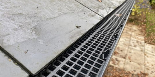 Gutter guard installation protecting guttering system from leaves and debris
