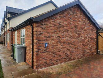 New guttering system installation with seamless white uPVC guttering