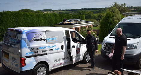 Rooftop Systems team vehicle showing professional roofline installation service