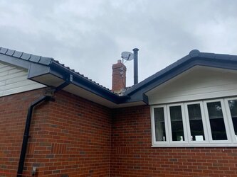 Professional soffit board installation with vented panels for airflow