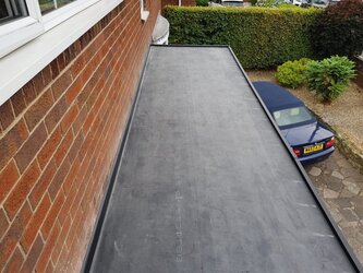 Durable flat roof porch installation enhancing home entrance